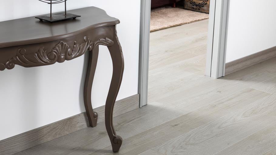 New access-baseboards in a wood finish by Butech: the ideal complement for ceramic parquet