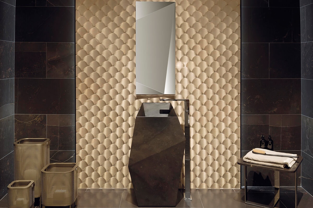 Bathroom with black stone and gold mosaic wall tiles