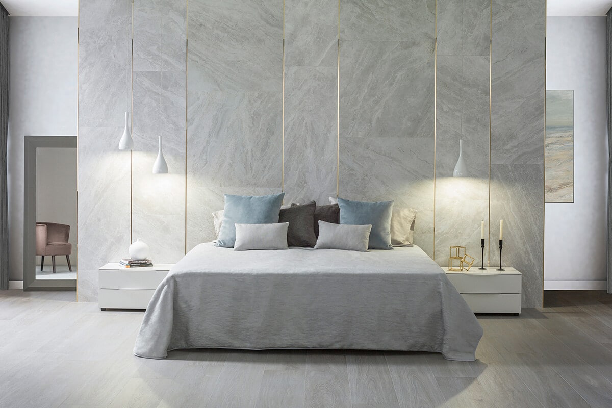 Grey bedroom with grey marble effect wall