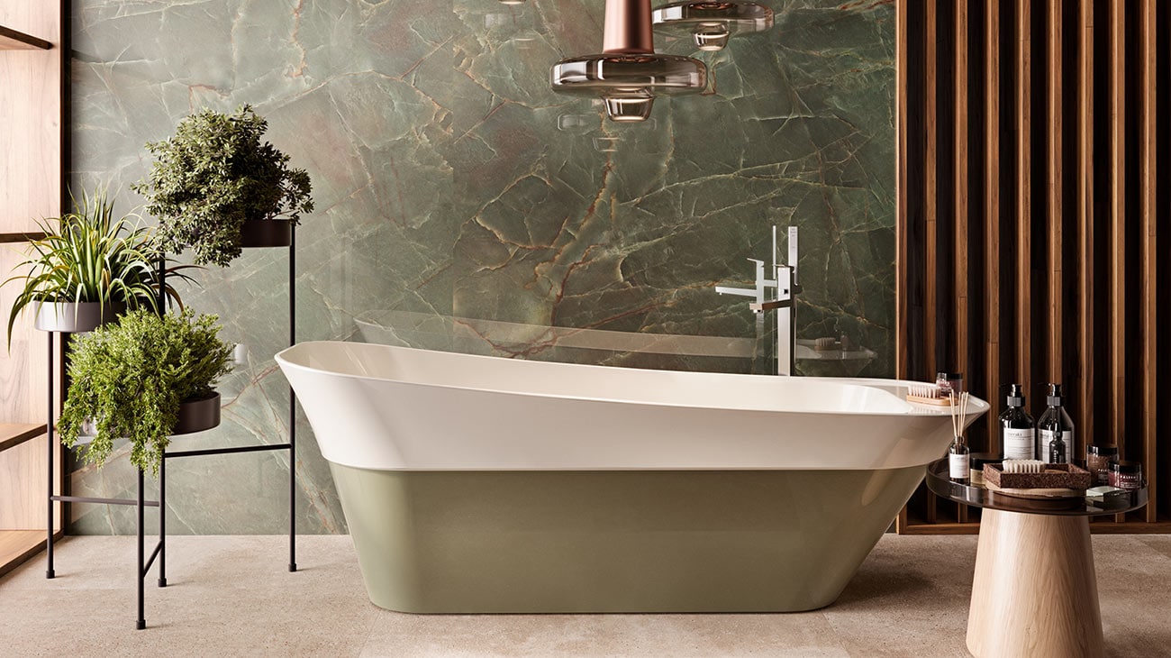 Bañera encastrada modelo Oxo de Noken combinando tonalidades blancas y verdes. 