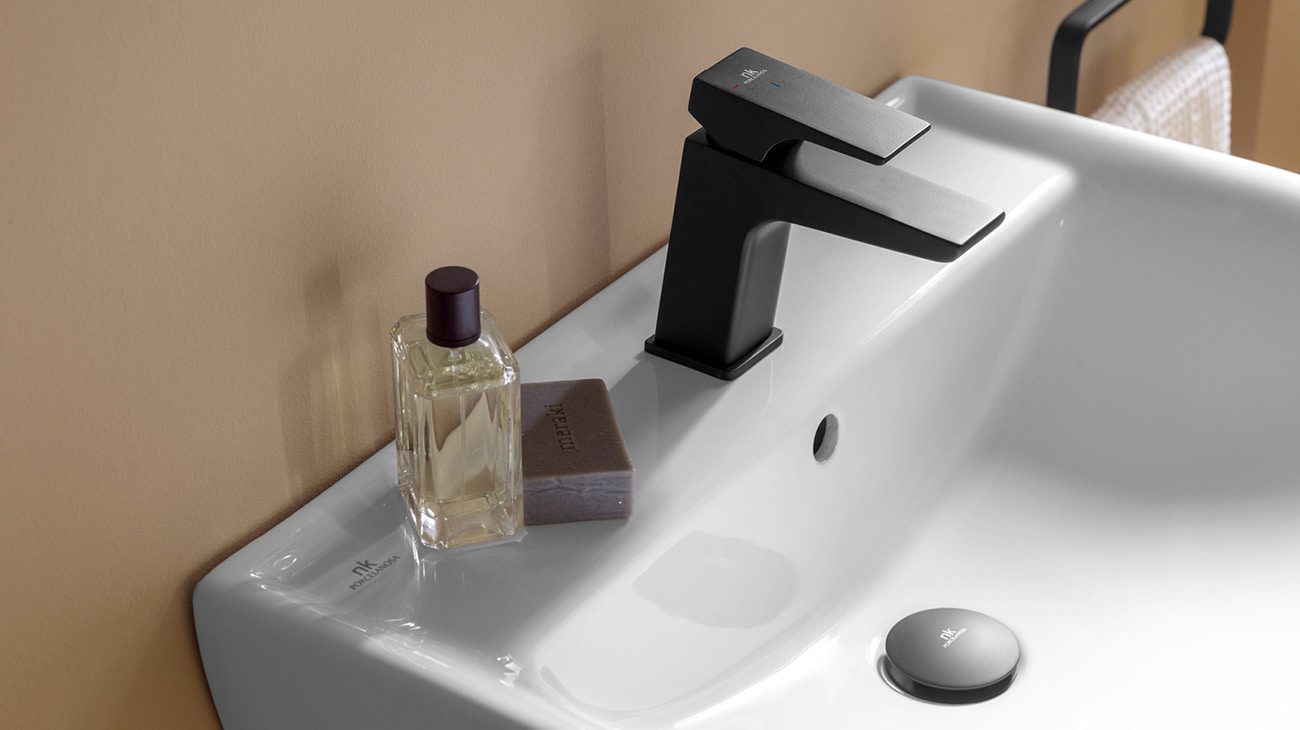 Acro Compact bathroom taps in matte black finish.