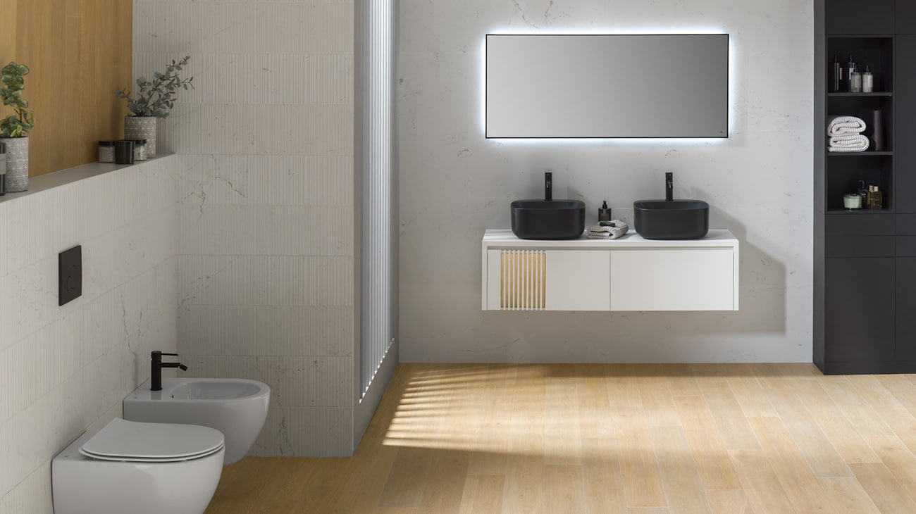 Madison Fontana Matt relief wall tile by Porcelanosa and Arquitect vanity, toilet and bidet by Noken.