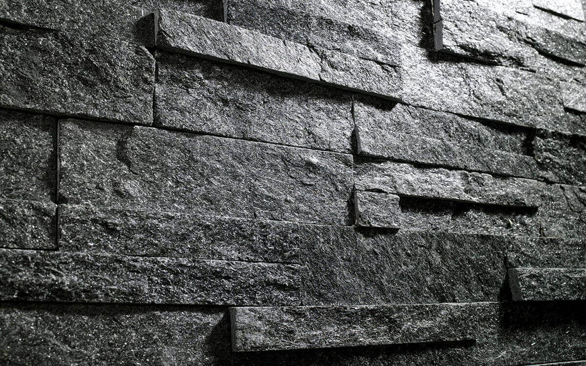 Black split face tiles wall