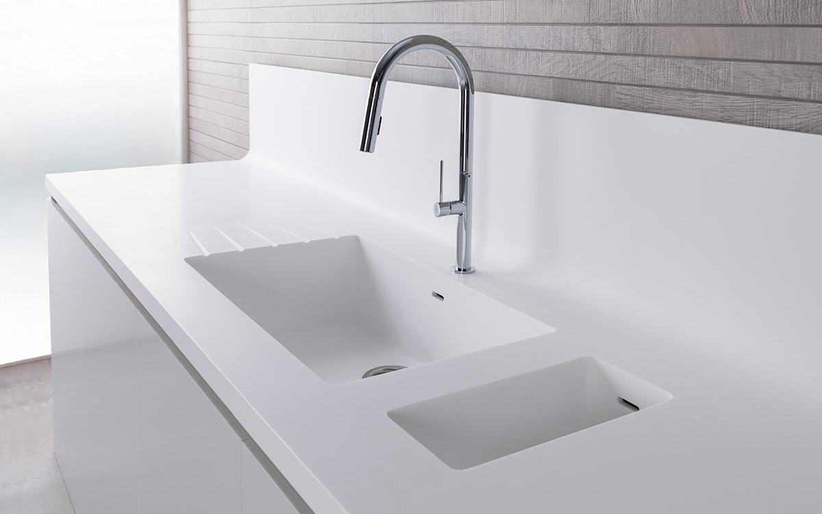 https://www.porcelanosa.com/trendbook/app/uploads/2023/08/White-composite-double-integrated-kitchen-sink.jpg